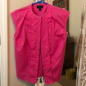 Pink button up blouse.